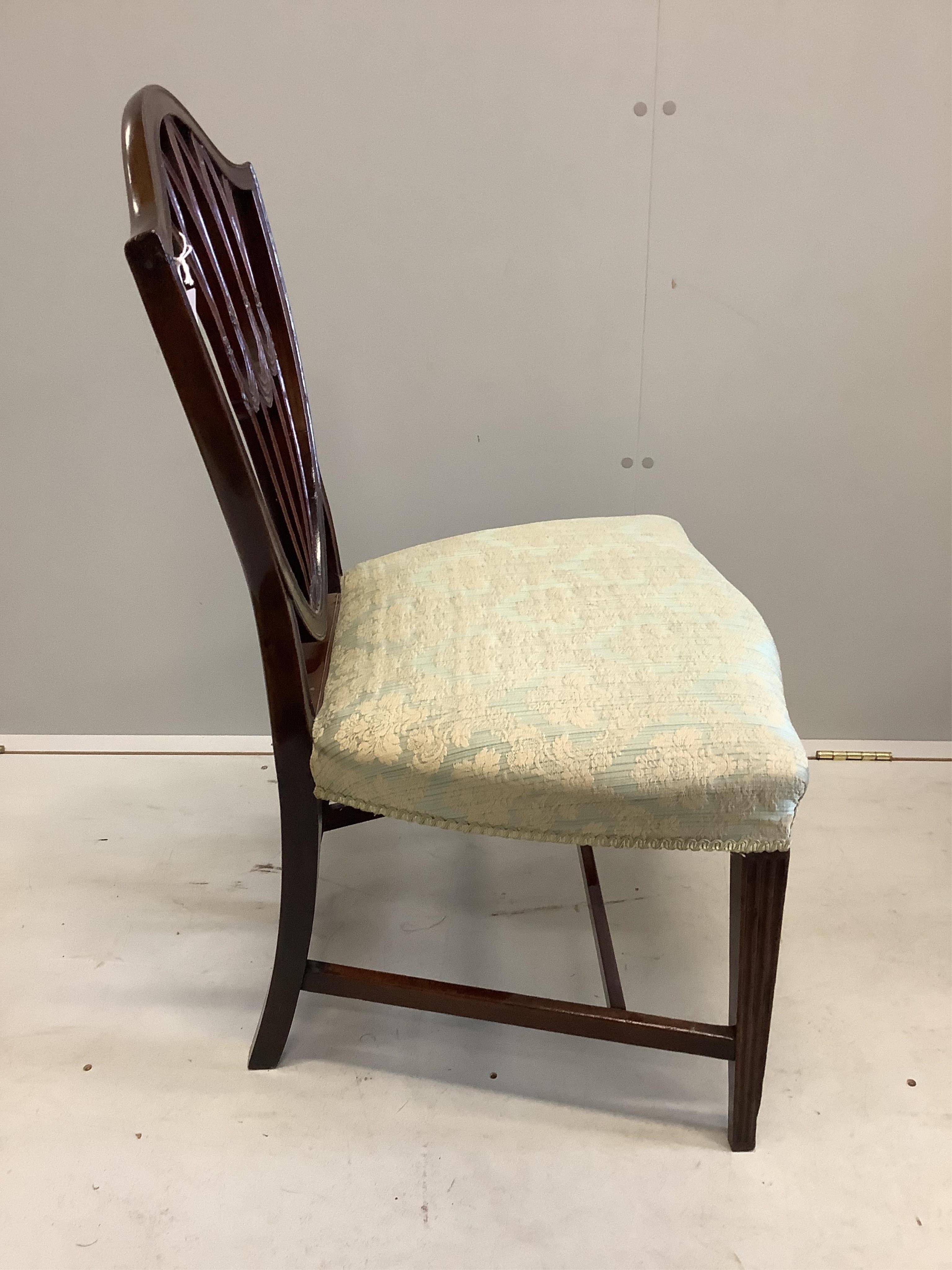 A pair of George III Sheraton style mahogany dining chairs and a pair of George III style mahogany elbow chairs. Condition - good